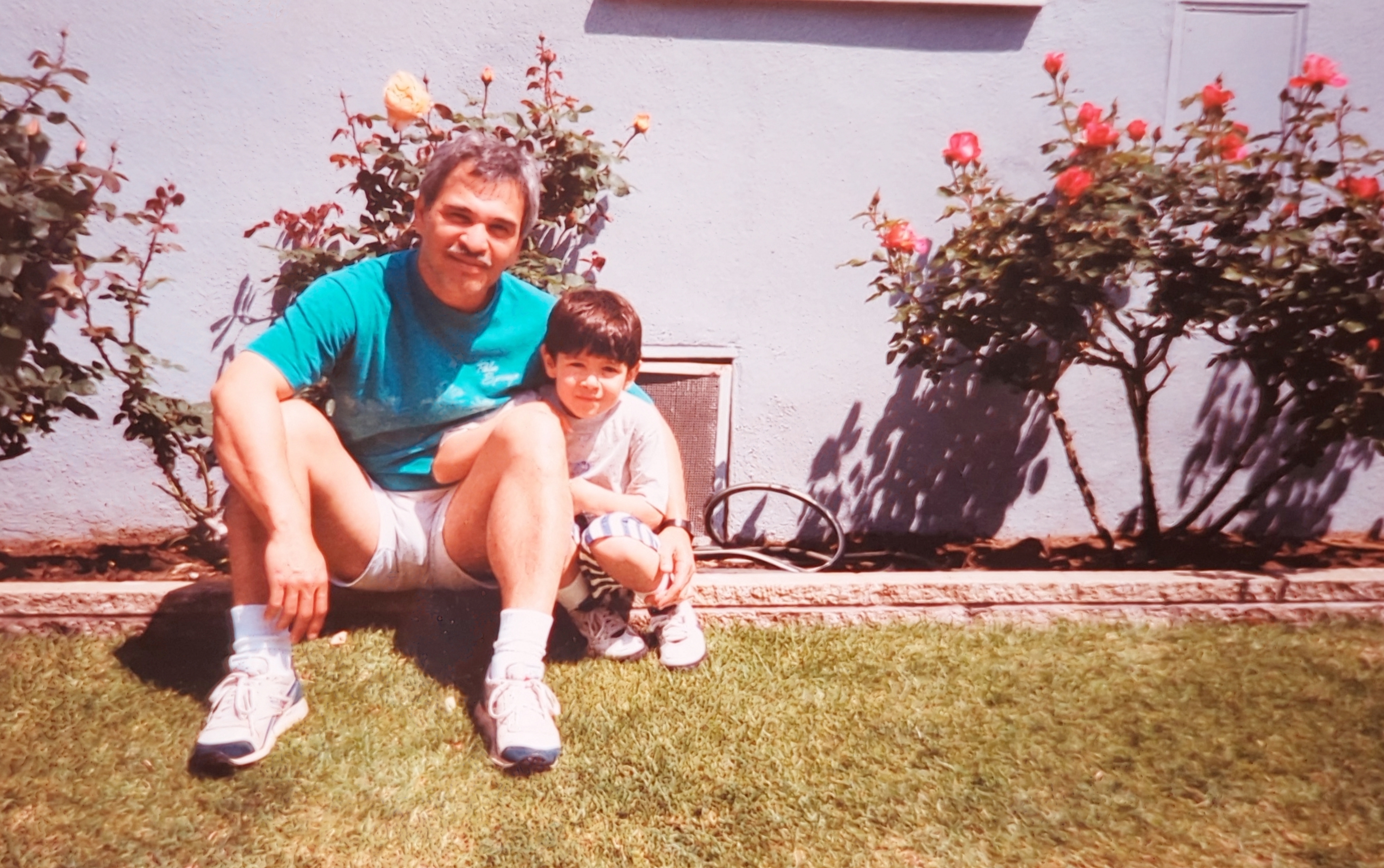 Me and Papa in the backyard of our old house in Westchester.